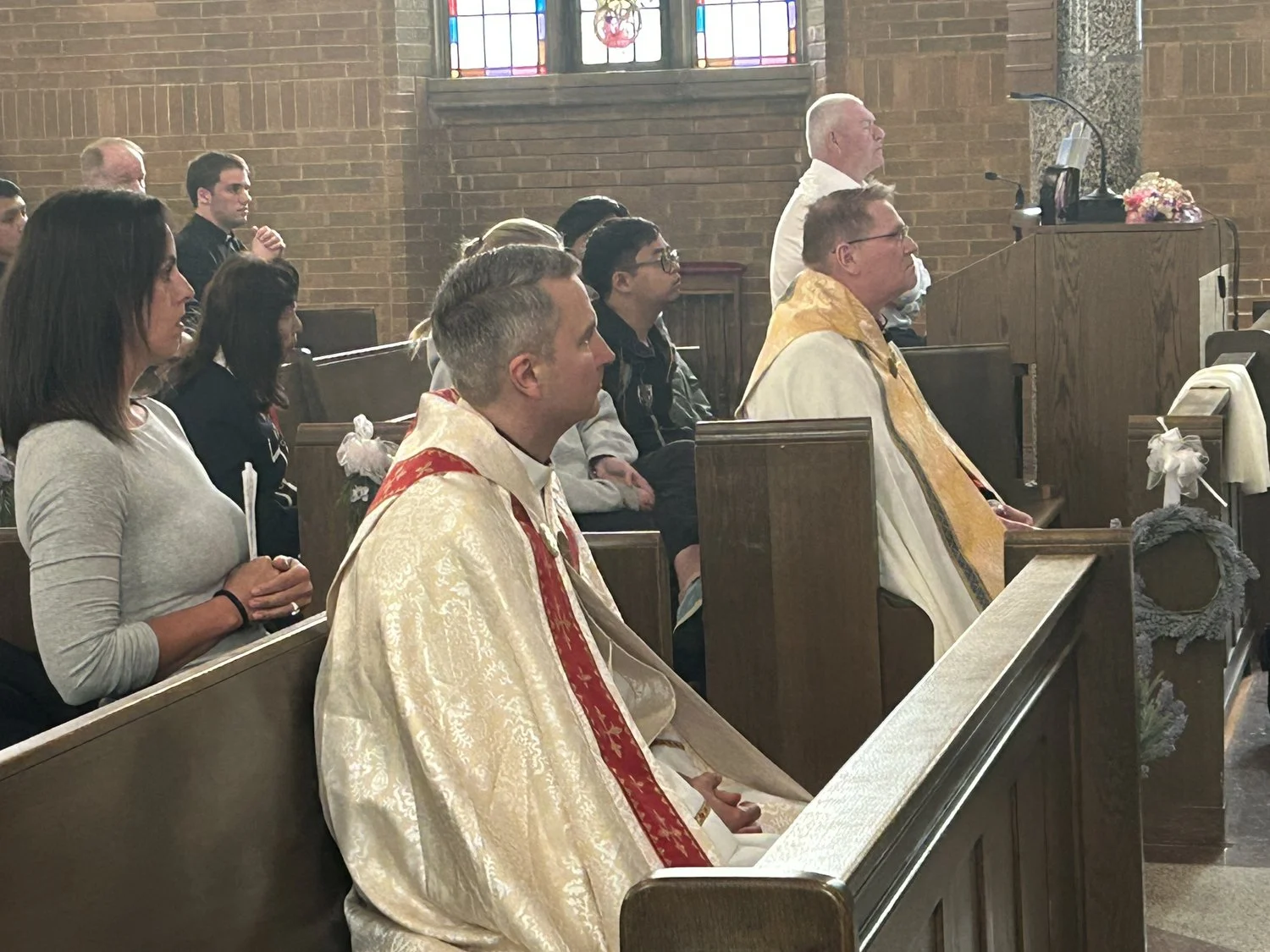 Bishop Hicks and Bishop Tylka sit in Adoration