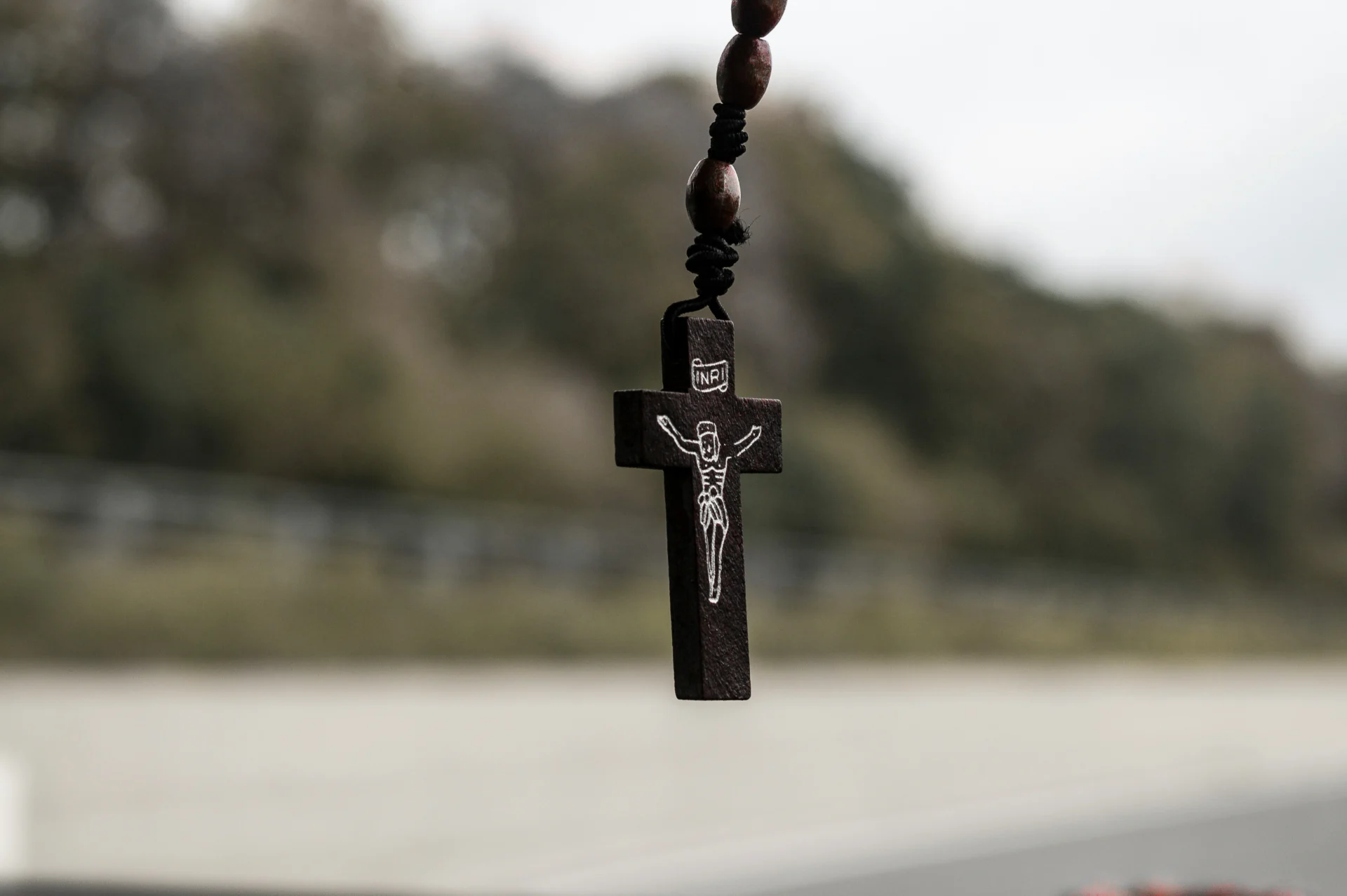Rosary hanging down with a nature background