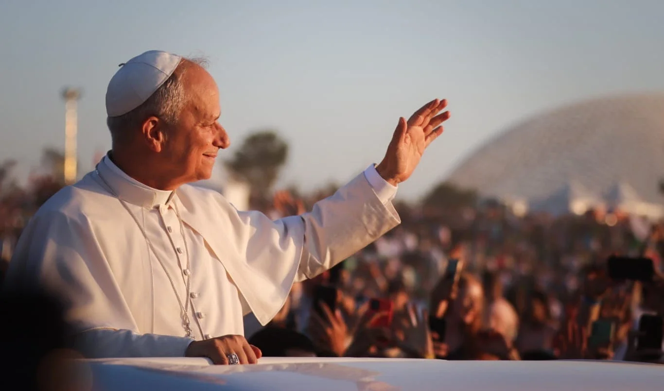 Pope Leo waves to a crowd